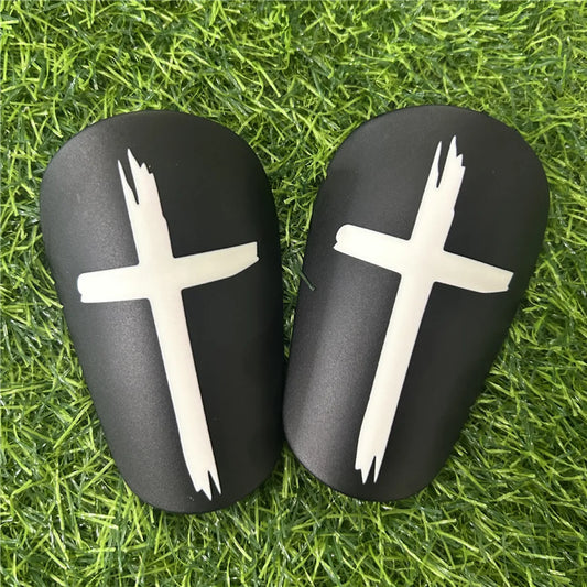 Black Shin-Guards With White Cross